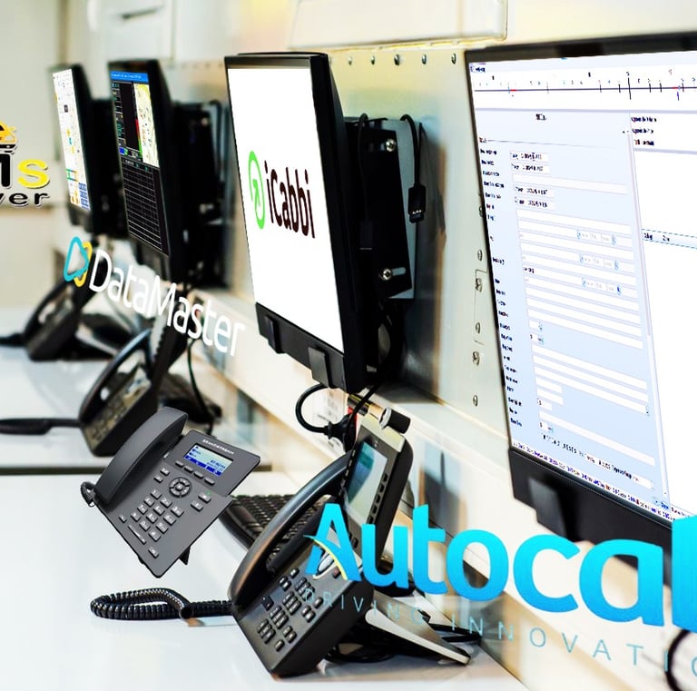 Modern dispatch workstations running iCabbi and DataMaster systems for taxi services.