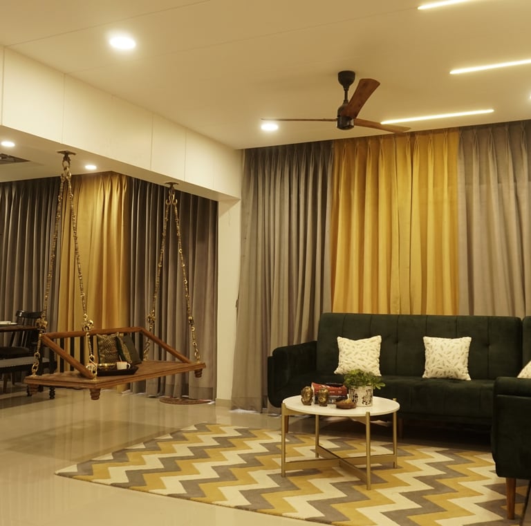 a living room with a couch and a ceiling fan