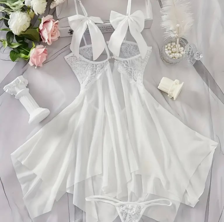 a white dress with a white dress and a bouquet of flowers
