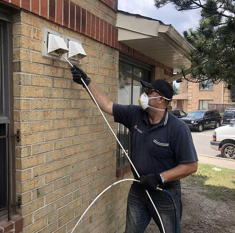 technician cleaning dryer vent