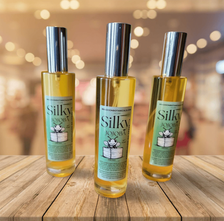 three bottles of silky body oil