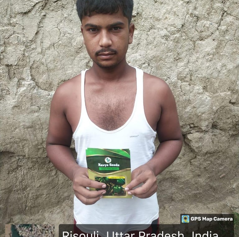 A farmer in Risouli, Uttar Pradesh, holding a packet of Kavya Seeds vegetable seeds for agriculture.