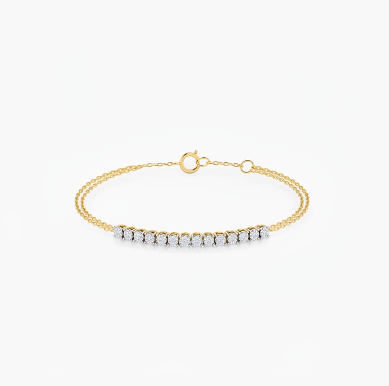 Elegant gold chain bracelet featuring a row of shimmering round-cut diamonds on a white background.