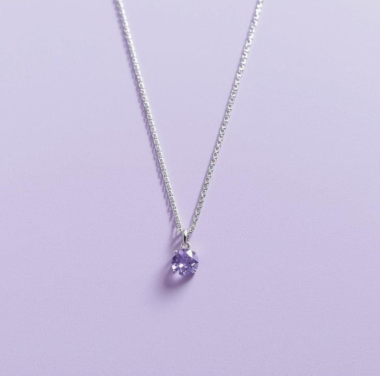 Elegant sterling silver necklace featuring a round purple amethyst pendant on a light purple background.