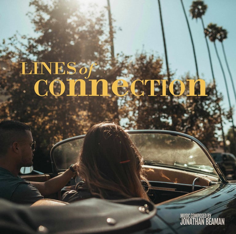 a couple sitting in a convertible car