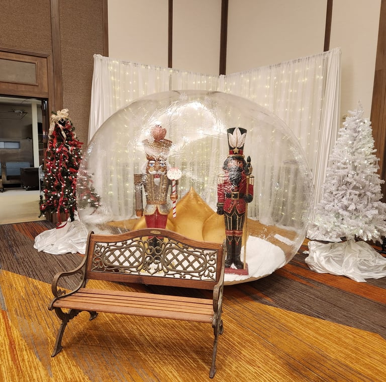 a christmas scene with a snow globe in a room
