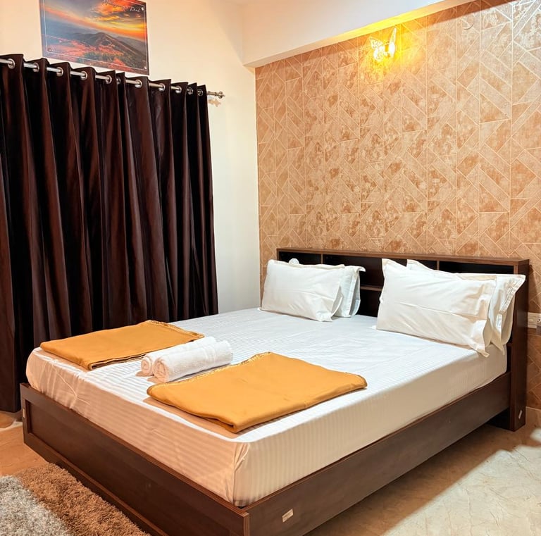 a bed with two pillows and a blanket on it