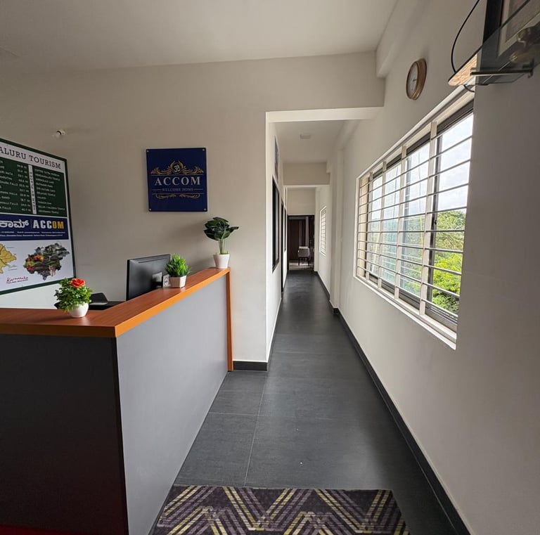 a hallway with a desk and a clock