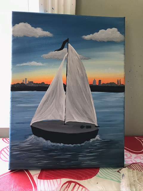 Sailboat in front of a Sunset Skyline