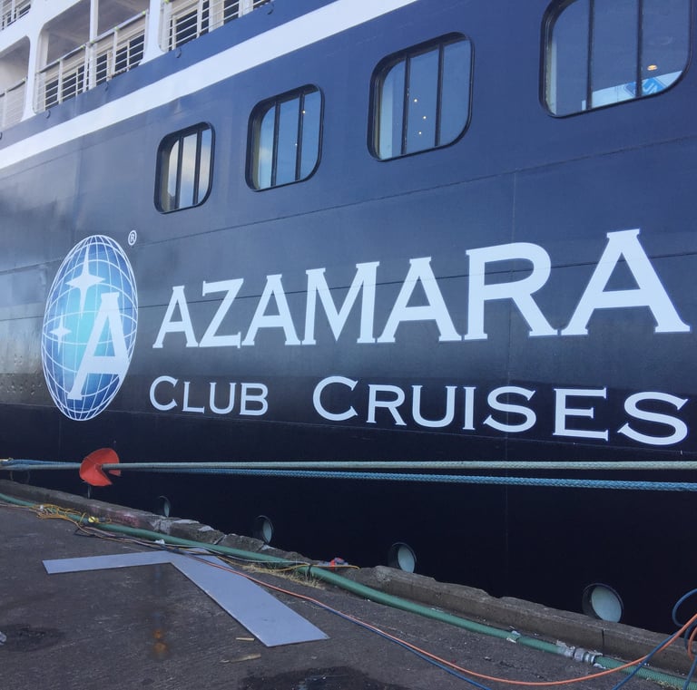 a large ship with a large sign that says azamara club cruise