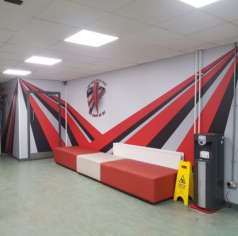 a room with a couch and a red couch