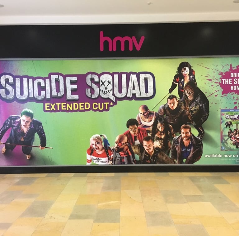 a large poster of a suicide squad movie poster
