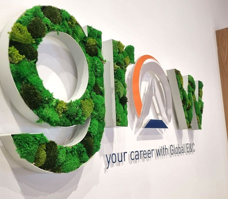 a sign that says go green with mossel mossel