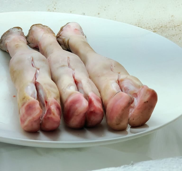 a plate of raw raw trotters