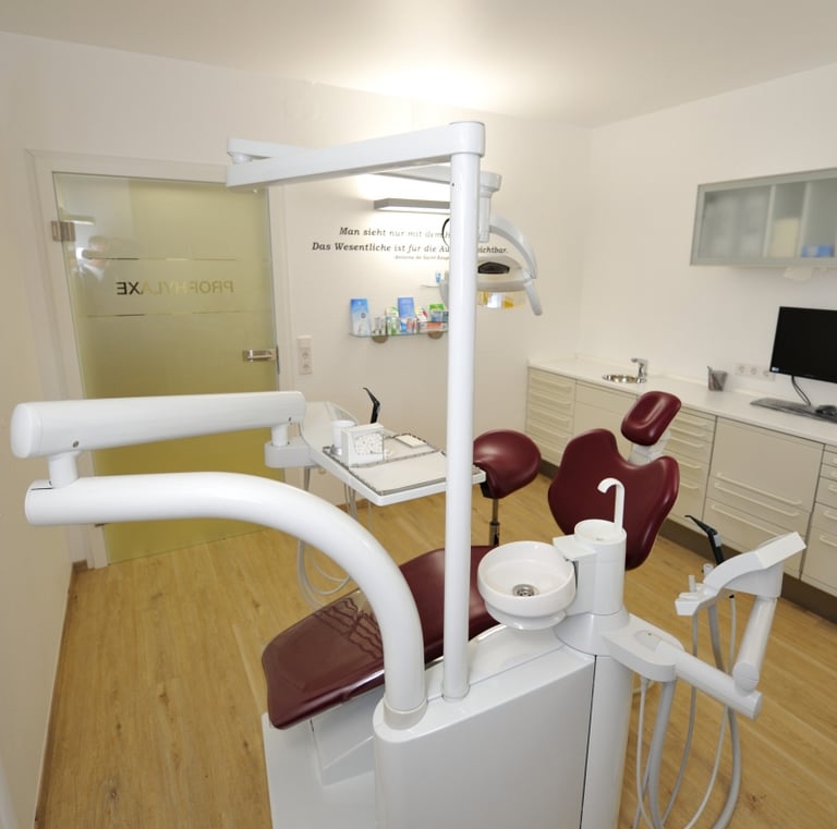 a dental room with a chair and a chair