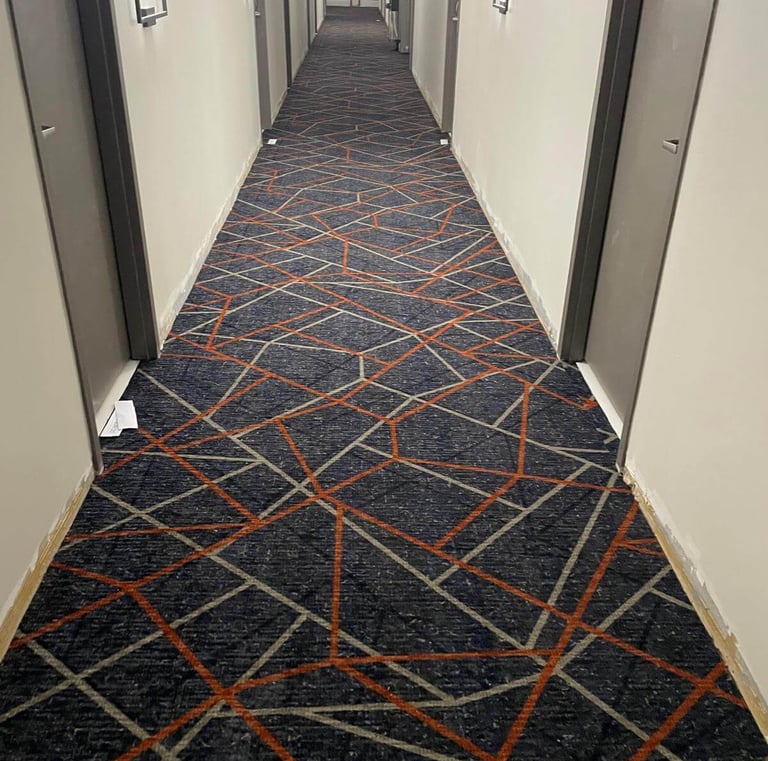 Patterned commercial carpet installed by Master Carpet in the hallway of Holiday Inn