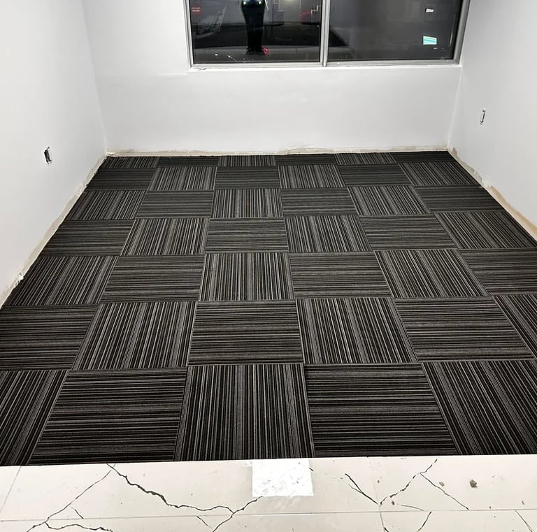 Office room with black commercial carpet tile, line design, quarter-turn install in Downtown London ON