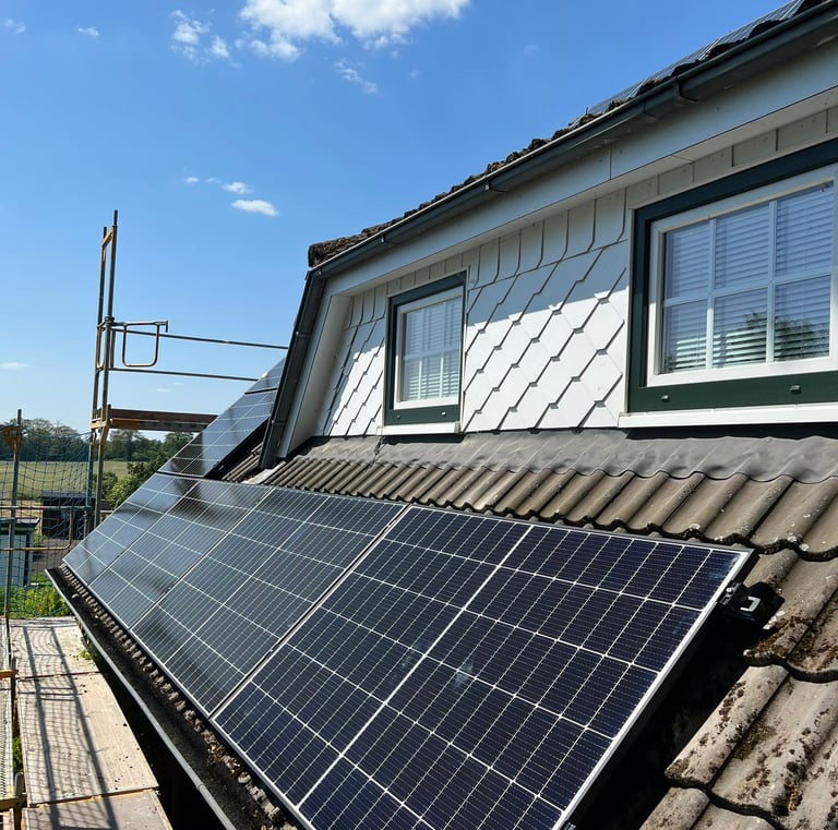 a solar paneled roof with solar panels on a roof