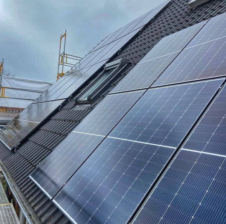 a solar paneled roof with solar panels and a crane
