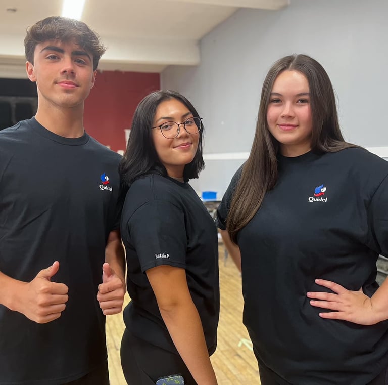 three people standing in a room