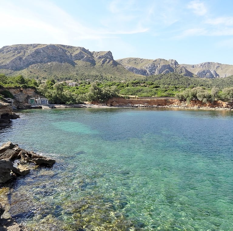a body of water with a mountain in the background