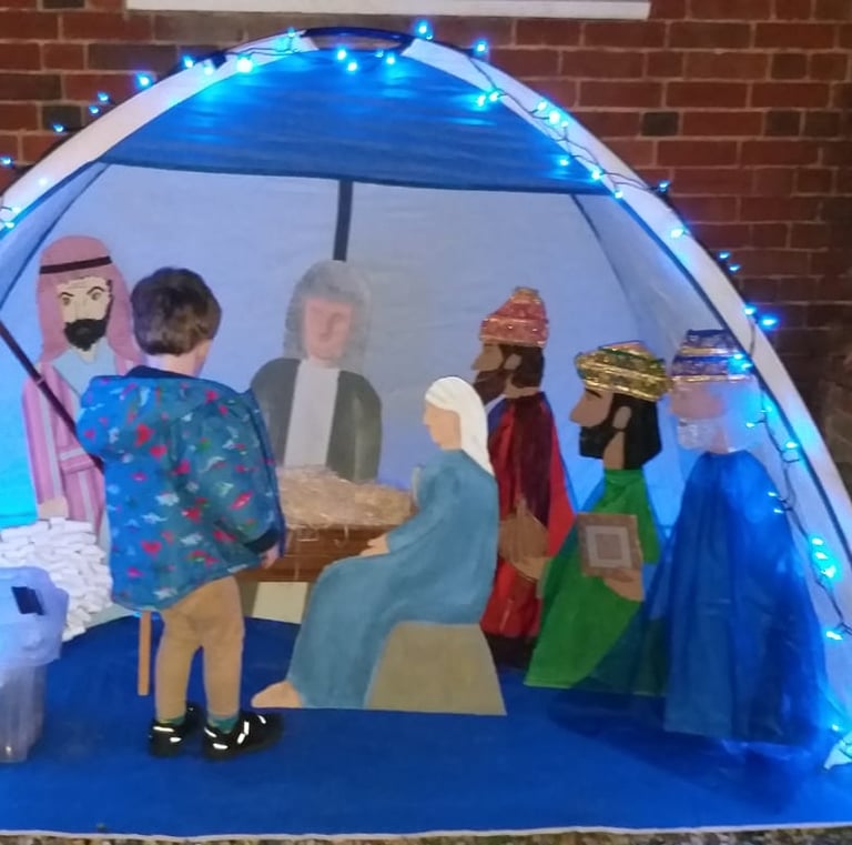 Child at a nativity scene