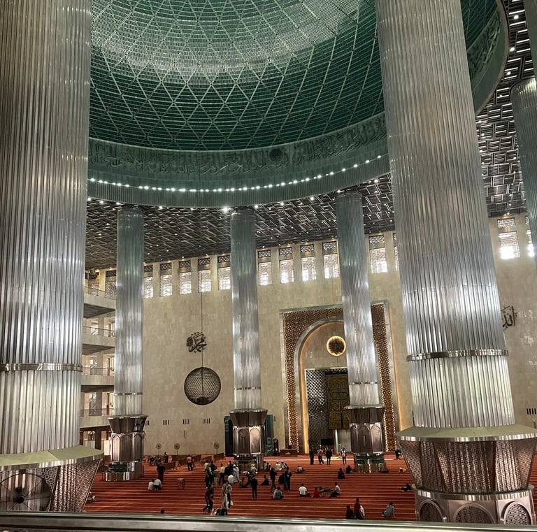Interior of Istiqlal Mosque in Jakarta, Indonesia, showcasing grand Islamic architecture