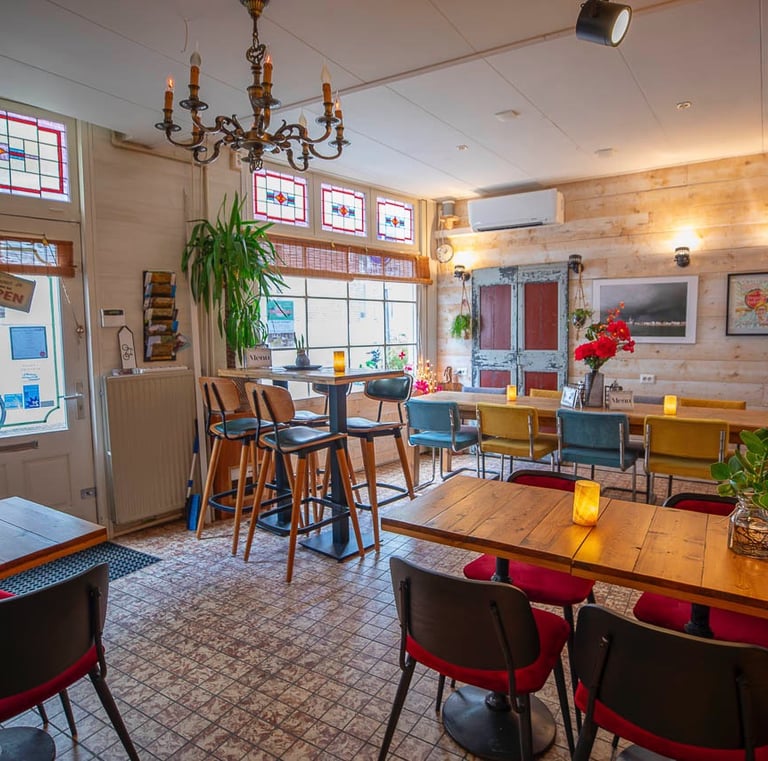 a restaurant with a table and chairs and a chandelier