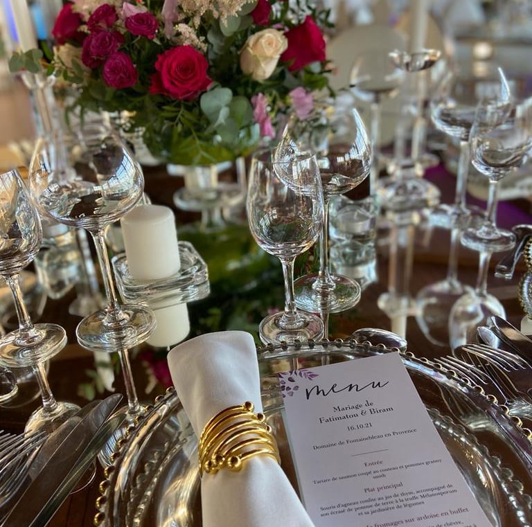 a table setting with a menu card and a menu