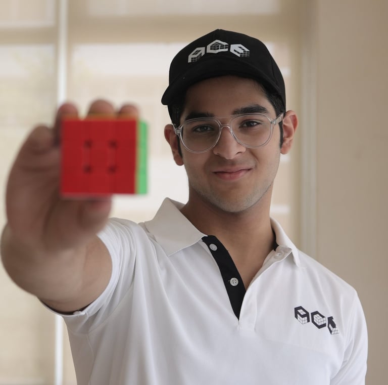 Medhansh Seth holding a cube 