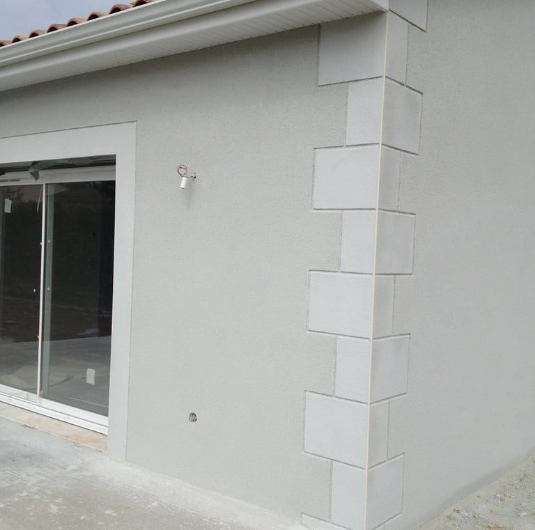 a house with a large window and a patio with a patio