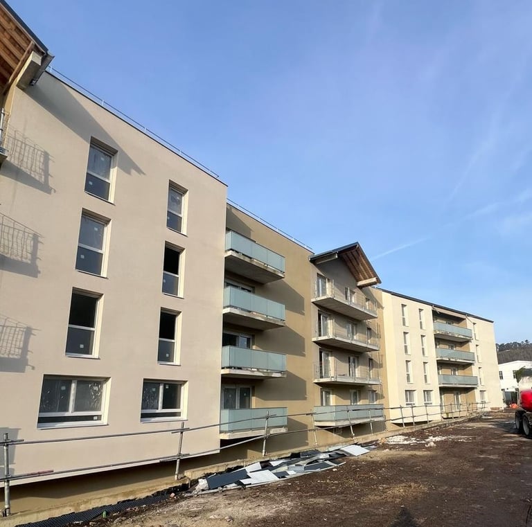 a person walking down a street with a red truck
