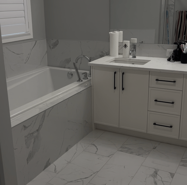 a bathroom with a marbled floor and a tub