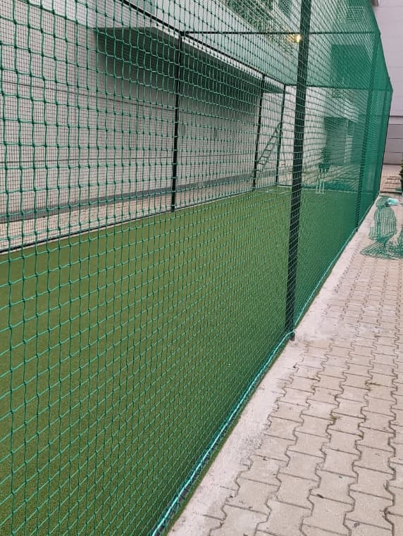 Close-up of a sturdy balcony safety net installed to keep pigeons away.