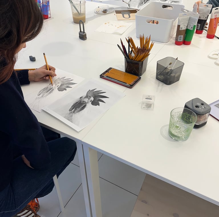 adults learning to draw in English art class Turin
