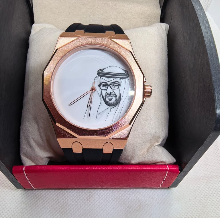 Luxury rose gold wristwatch with a portrait of a Sheikh on the dial, presented in a gift box.