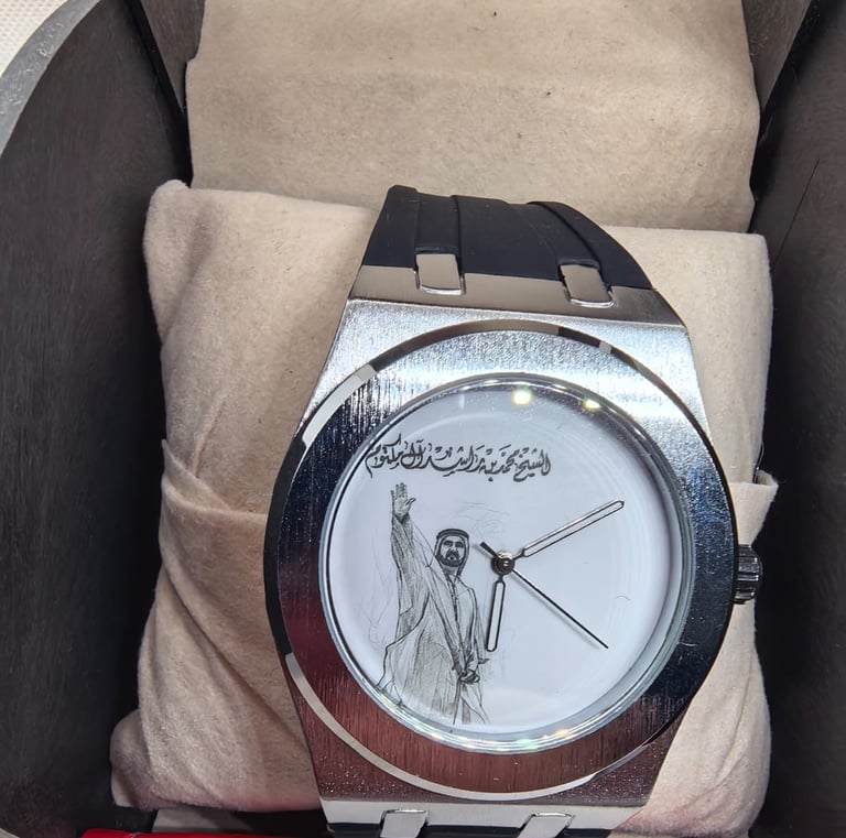 Luxury wristwatch with a portrait of Sheikh Mohammed bin Rashid Al Maktoum on the dial.