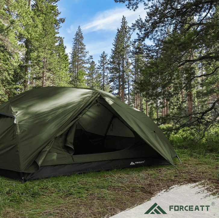 a tent with a tent pitched up in the woods