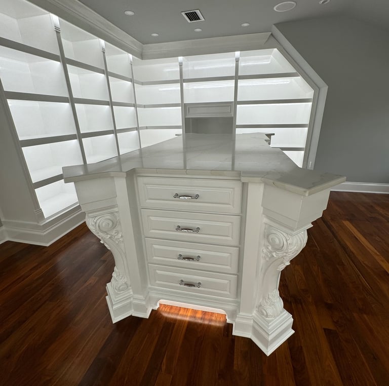Custom made closet island with handles in a showroom- Britto's Home Improvement