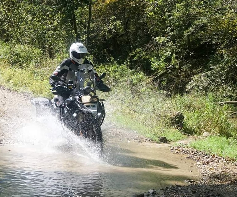 2015 on the Trans Wisconsin ride fording a bit of water and mud on my BMW F800 GS
