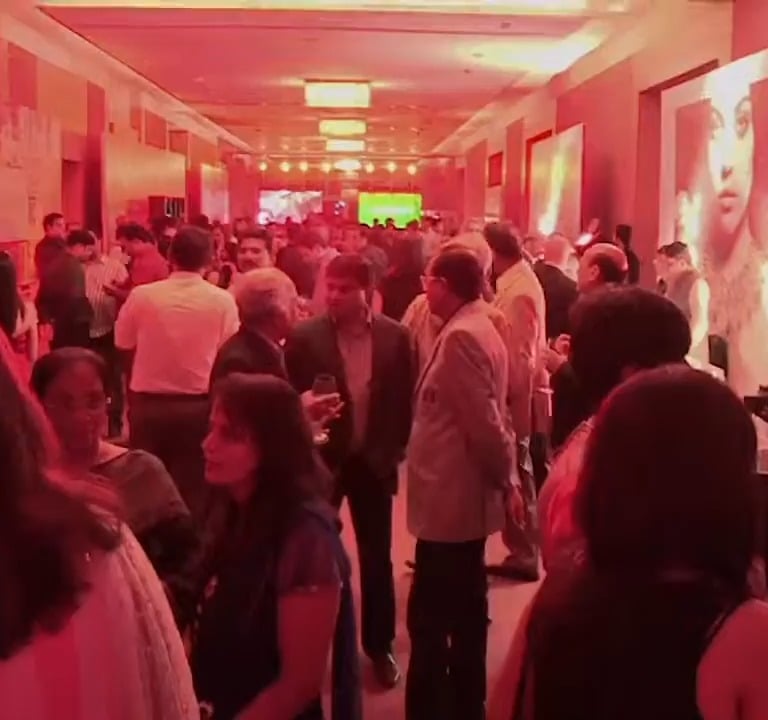 a group of people standing in a hallway