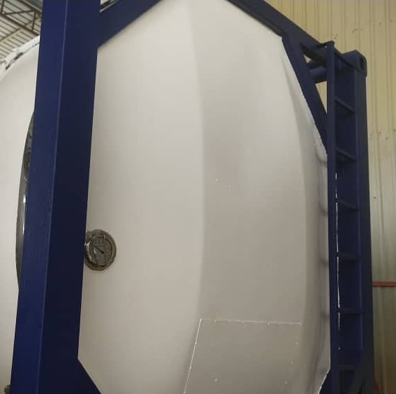 a large white tank sitting on top of a metal rack