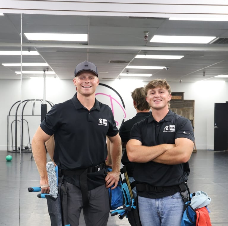 kyler and luke smiling at the camera, owners of Spartan