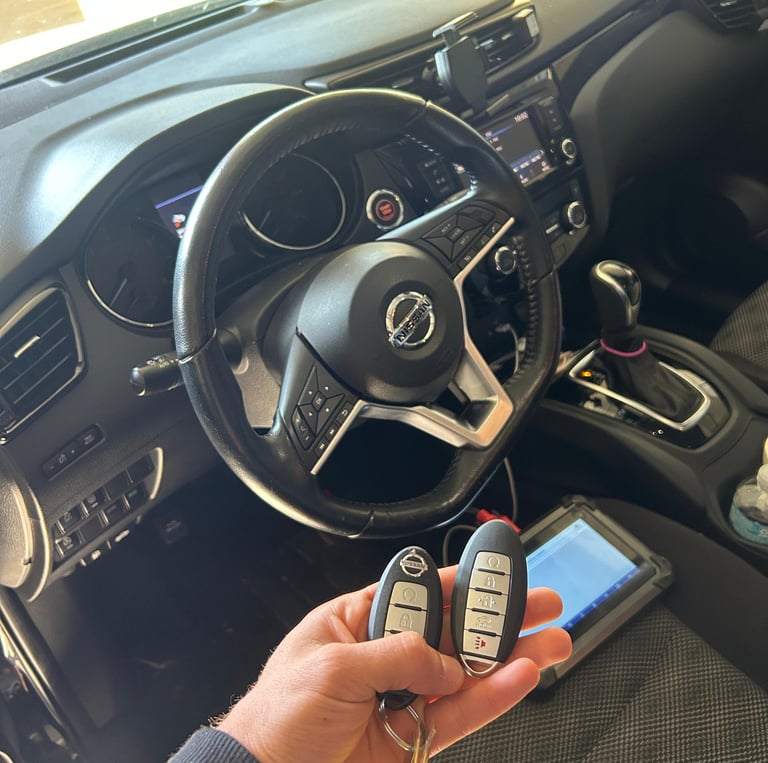 locksmith programming a car key fob on-site for a modern vehicle in Flagler County