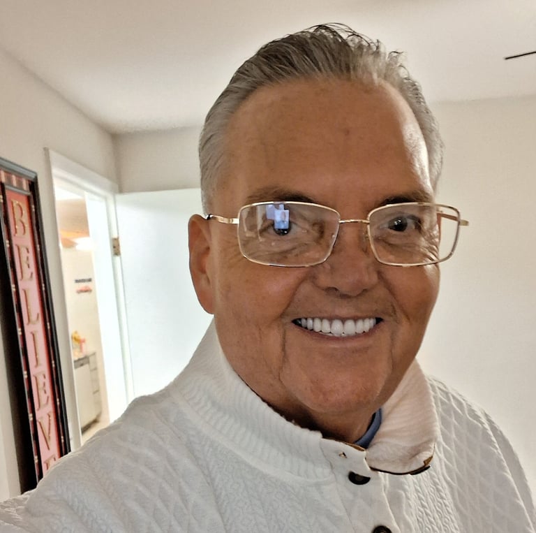 a man in a white shirt and glasses