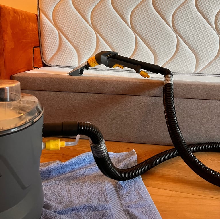 a couch with a vacuum and a vacuum