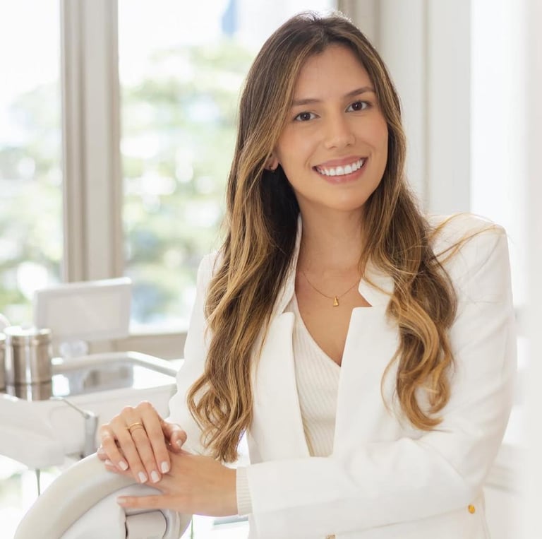 a woman in a white suit and white shirt