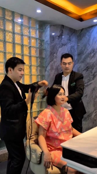 a man and woman in a salon