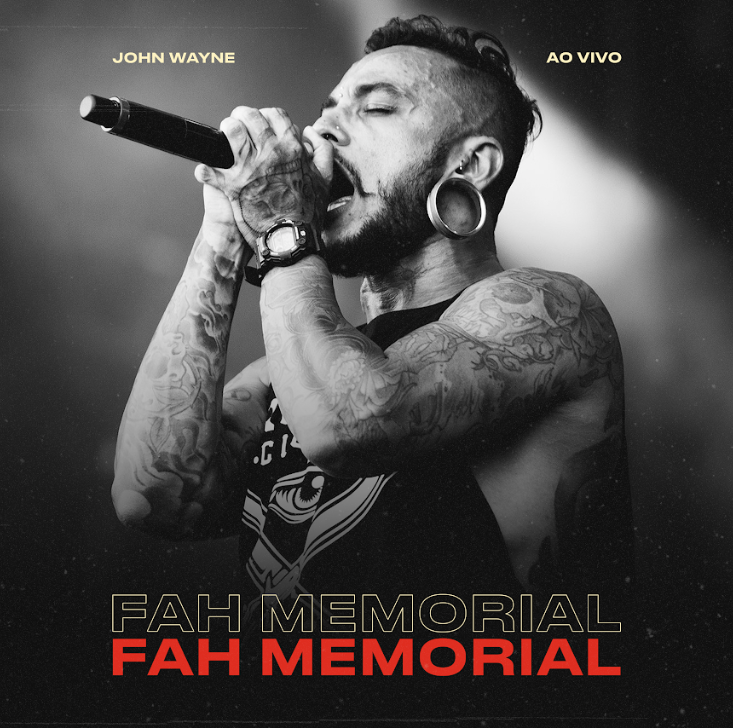 a man with tattoos on his chest and a microphone