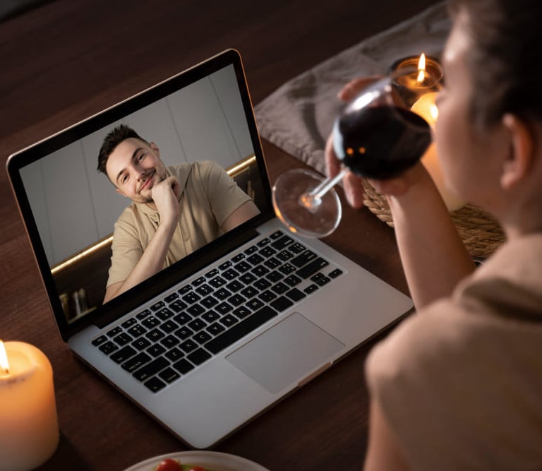 Sugar mommy enjoying a virtual date with a man through an online video call